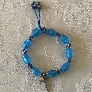 BABY BLUE BRACELET WITH THE SIGN OF THE CROSS!